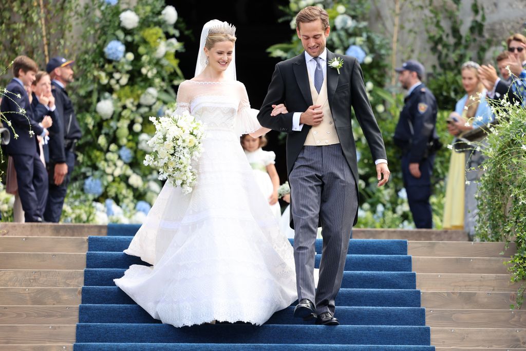 Princess Marie Caroline of Liechtenstein and Mr. Leopoldo Maduro Vollmer walking down steps after their wedding