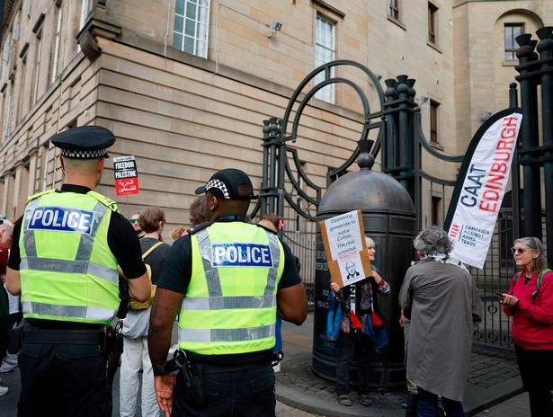 Supporters of three women charged with terrorism offences gather outside Edinburgh Sheriff Court today