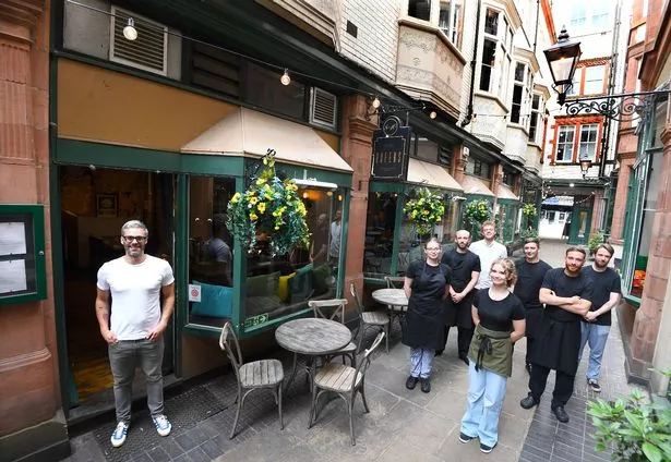 Co-owner Lucas Pires (far left) and the staff at Queens Wine Bar & Bistro, Queen Avenue