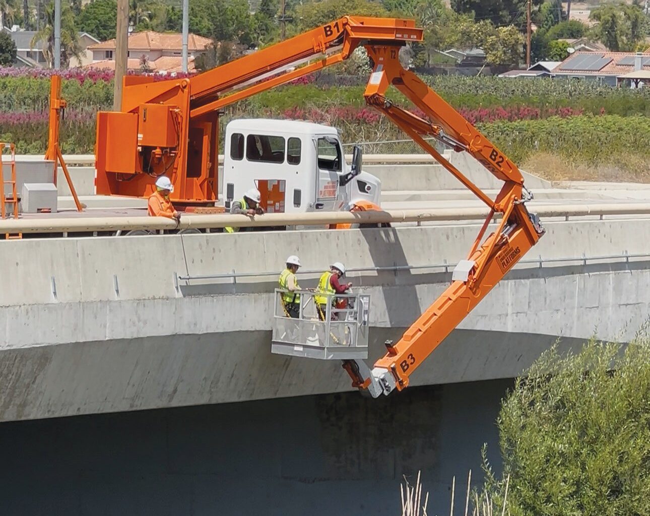 FIBER OPTICS—Aspire’s construction in Moorpark began in late May. At right, a worker is “microtrenching” in a street, installing fiber-optic cables in narrow, shallow trenches cut into streets or sidewalks. Courtesy photos