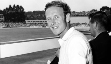 Derek Underwood looks at photographs of his ten wickets