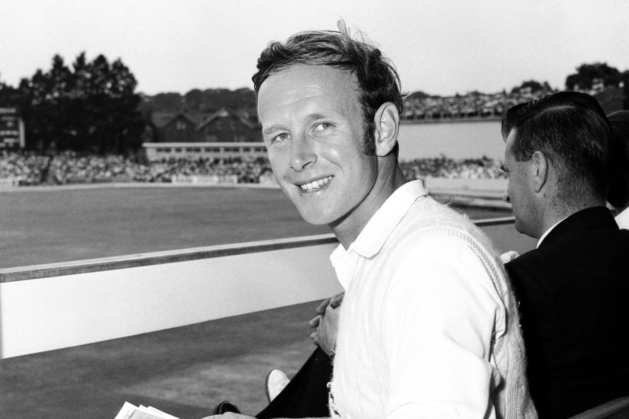 Derek Underwood looks at photographs of his ten wickets