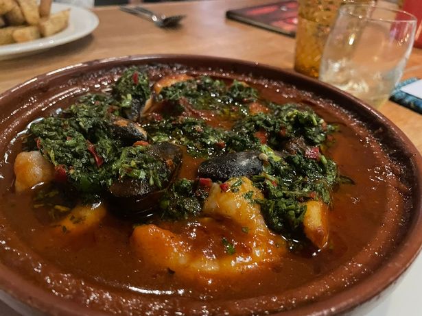 tagine of Cornish hake, braised squid, mussels, wild Atlantic prawns, saffron potatoes and chermoula