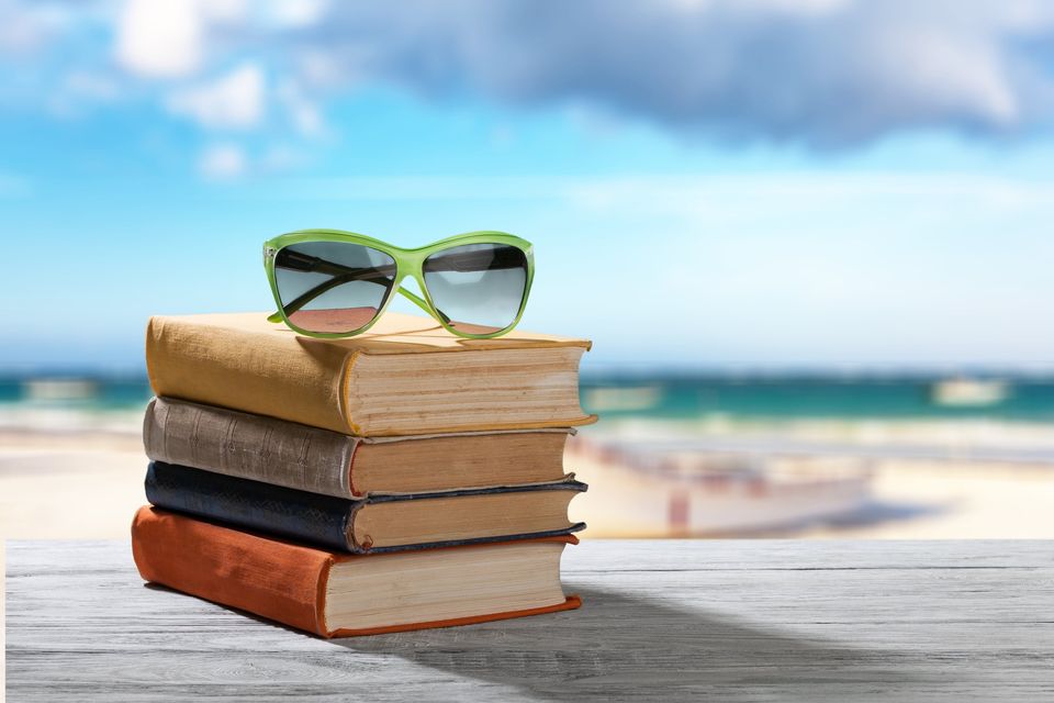 Nothing beats a good page-turner while you're on holidays. Photo: Getty