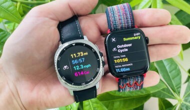 Close-up of the Apple Watch Series 10 and Samsung Galaxy Watch 8 Classic in a user's hand showing the results of a logged bike ride