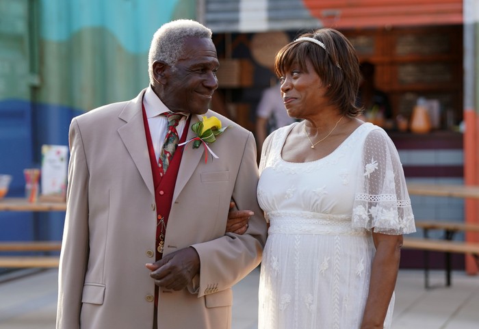 Patrick and Yolande get married and look lovingly at each other