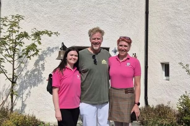 Will Ferrell poses with staff during his visit to Braemar Castle