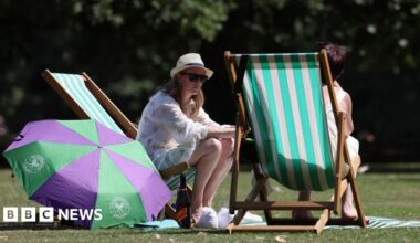 Londoners enjoy the warm weather at a park in London