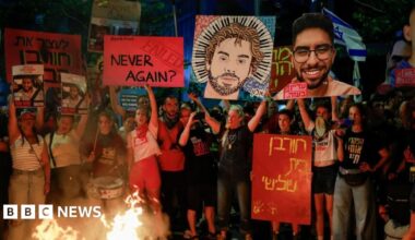 Demonstrators in Tel Aviv stand by a fire, during a protest to demand the immediate release of hostages held in Gaza