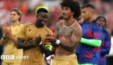 Marc Guehi and Chris Richards applaud the Crystal Palace fans