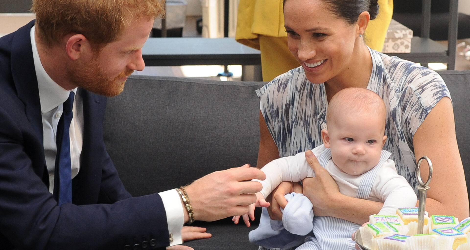 Meghan Markle cradles Prince Archie while Prince Harry fusses over him
