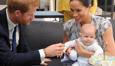 Meghan Markle cradles Prince Archie while Prince Harry fusses over him