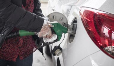 A person filling up a car’s fuel tank