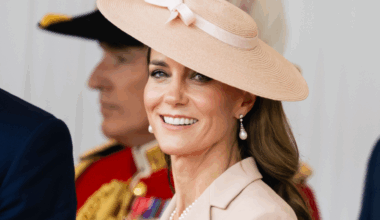 Princess Kate wearing a pink hat with a bow smiling