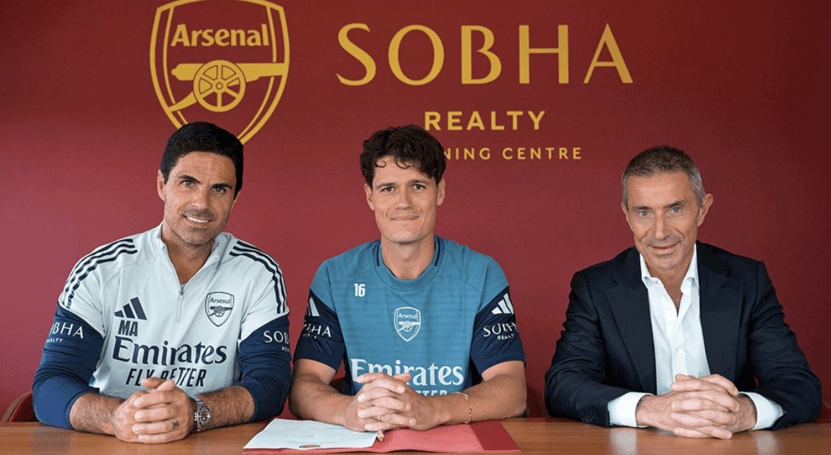 Christian Norgaard signing for Arsenal (Photo via Arsenal.com)