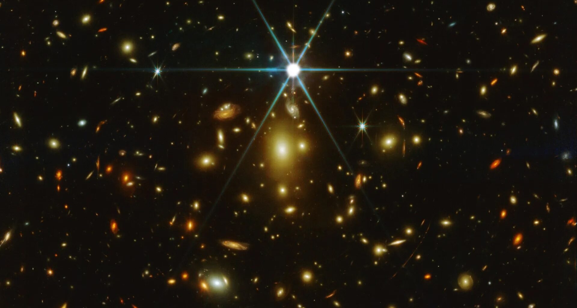 a deep field image showing many stars and galaxies