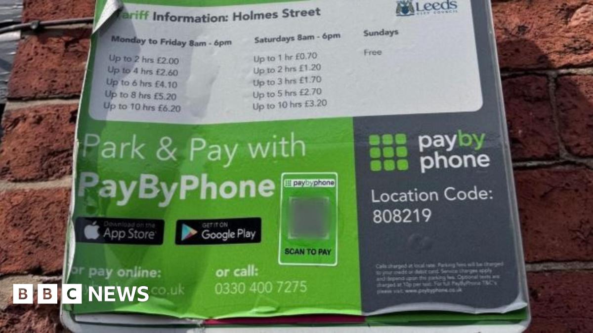 A notice with parking information on. It includes a barcode, contact details and tariffs.