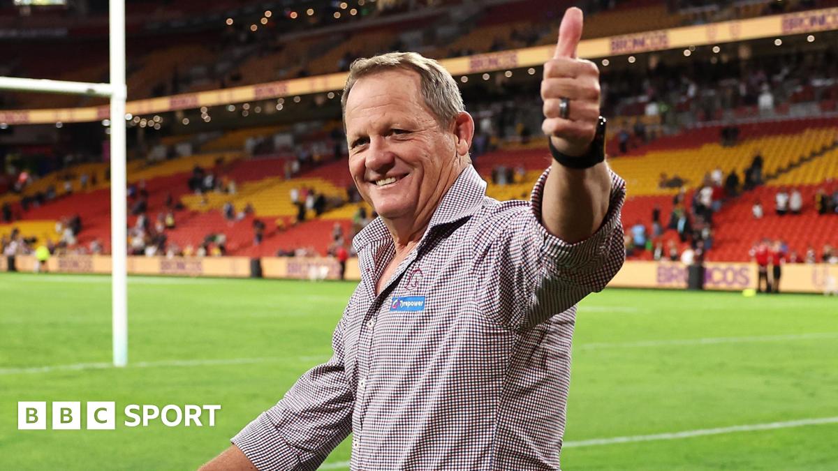 Kevin Walters gives a thumbs up to fans while doing a lap of honour of the pitch at Suncorp Stadium after Brisbane Broncos beat Manly Sea Eagles in the NRL.