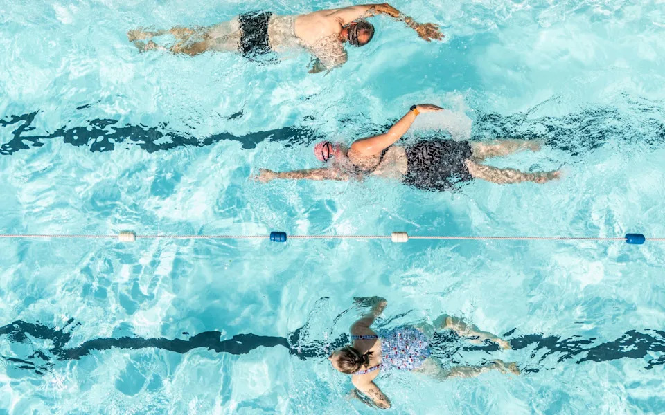 People swimming at Hope Valley in the Peak District, Derbyshire