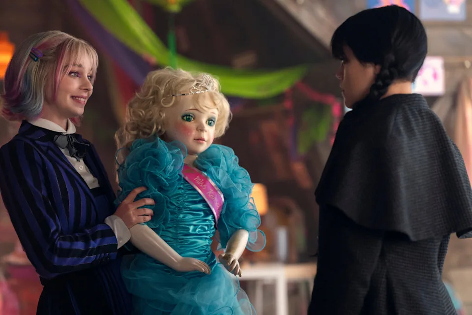 Enid (Emma Myers, left) gets a strange back-to-school gift from roommate/bestie Wednesday (Jenna Ortega) in the Season 2 premiere of Netflix's "Wednesday."