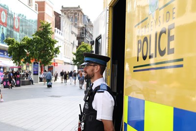 Police officer outside a mobile station