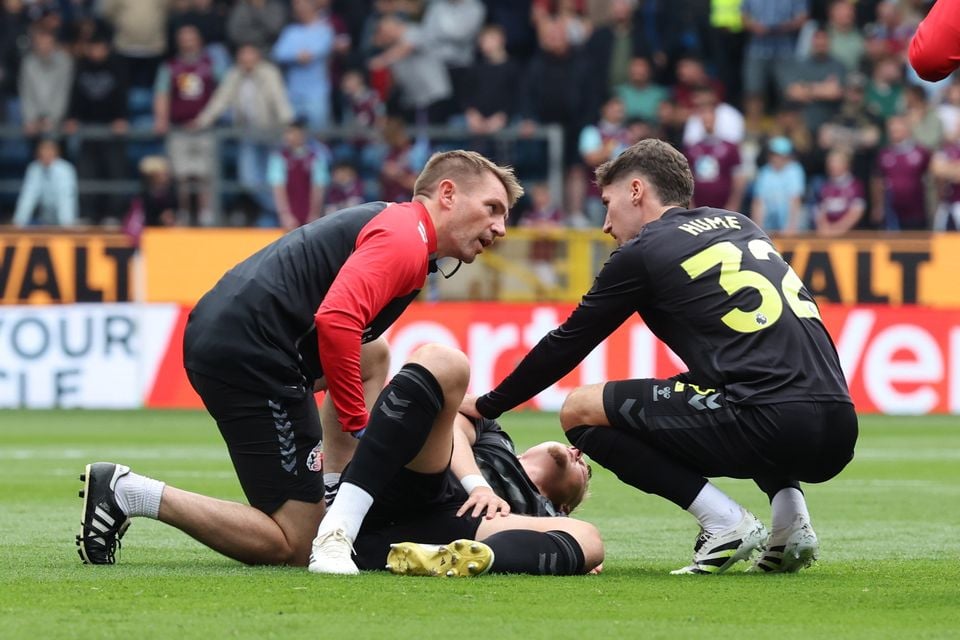 Dan Ballard of Sunderland is comforted by Northern Ireland and Sunderland teammate Trai Hume