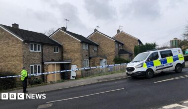 Police cordon outside damaged property