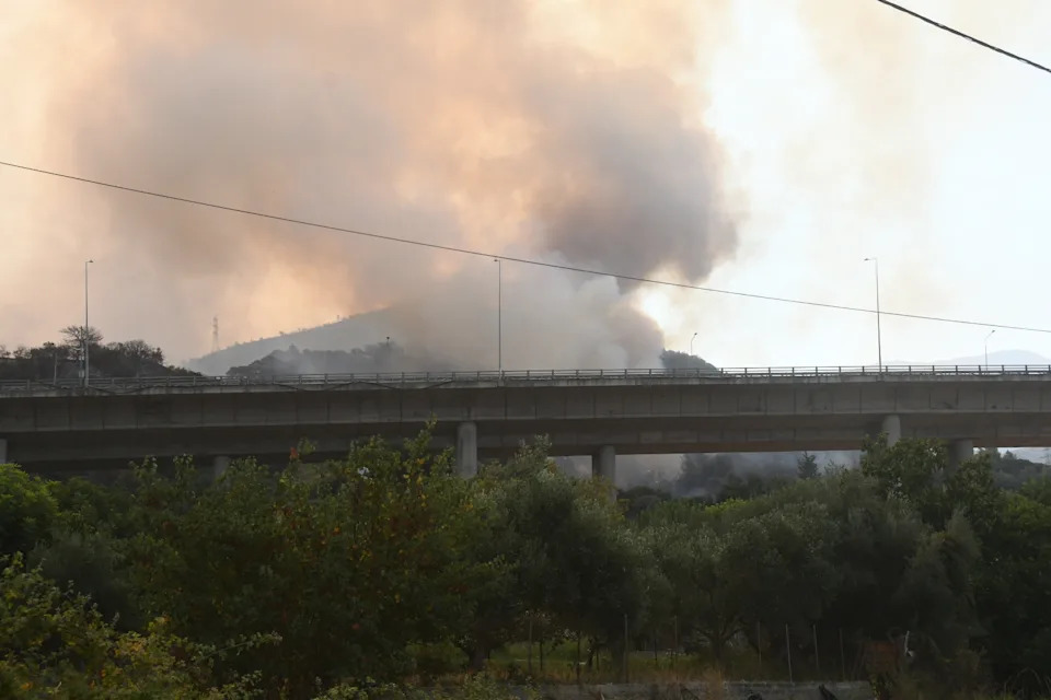PATRA, GREECE - AUGUST 13: Firefighting efforts continue from both air and ground as flames spread rapidly across a large area due to strong winds after a wildfire broke out in the Fotia region of Patra, Greece, on August 13, 2025. (Photo by Yannis Andritsopoulos/Anadolu via Getty Images)