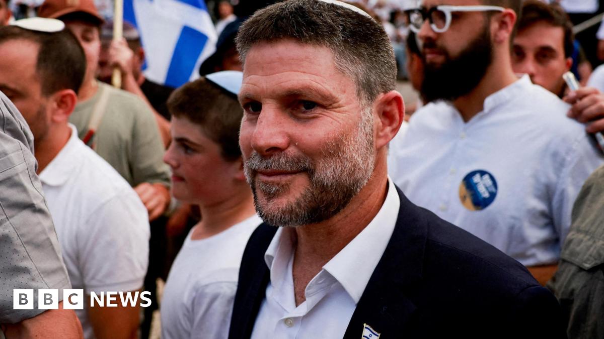 A close up shot of  Israeli Finance Minister Bezalel Smotrich during an event at the Damascus Gate in Jerusalem's Old City. He is surrounded by police officers and young supporters.