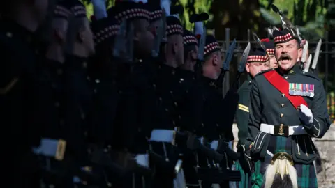 PA Media Members of Balaklava Company, 5th Battalion, The Royal Regiment of Scotland, at the gates of Balmoral, before King Charles III carries out an inspection