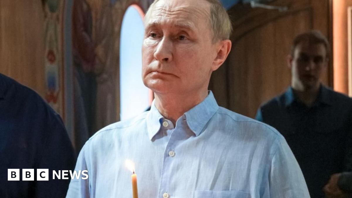 Russian President Vladimir Putin holds a candle during a service at the Valaam Monastery in north-western Russia. Photo: 1 August 2025