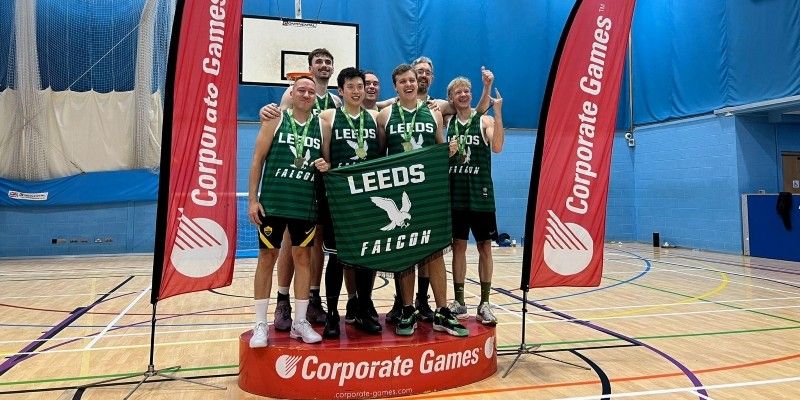 University of Leeds basketball team stood on the podium at the basketball court. 