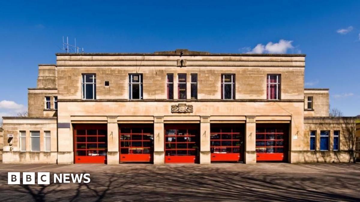 The entrance to an Avon Fire and Rescue station in Bath made of Bath stone with five gates.