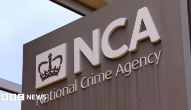 The National Crime Agency logo on a corporate totem. There are white letters on a grey background.