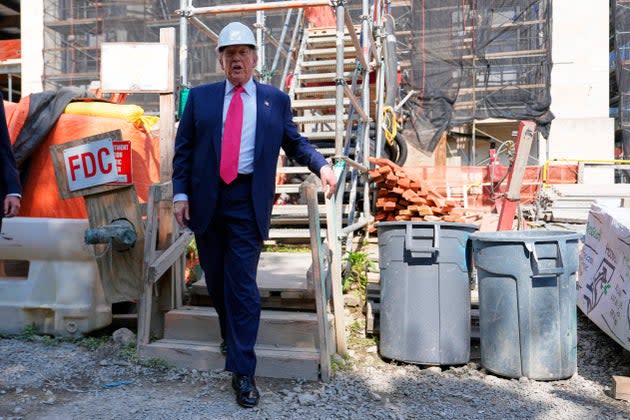 President Donald Trump visits the Federal Reserve during renovations last week in Washington. Trump repeatedly has blamed Fed chair Jerome Powell for the state of the economy. 