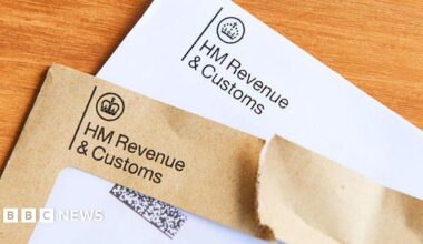 Two envelopes, one brown and one white, which have been sent by HMRC. They read "HM Revenue and Customs" on the front with a crown logo.
