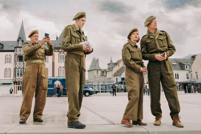 Alex Crétey Systermans World War II enthusiasts in Canadian uniform outside the Musée du Débarquement, in Arromanches-les-Bains.