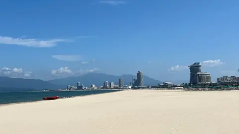 Anastasia Samsonova Empty sandy beach and hotels at the Wonsan-Kalma resort