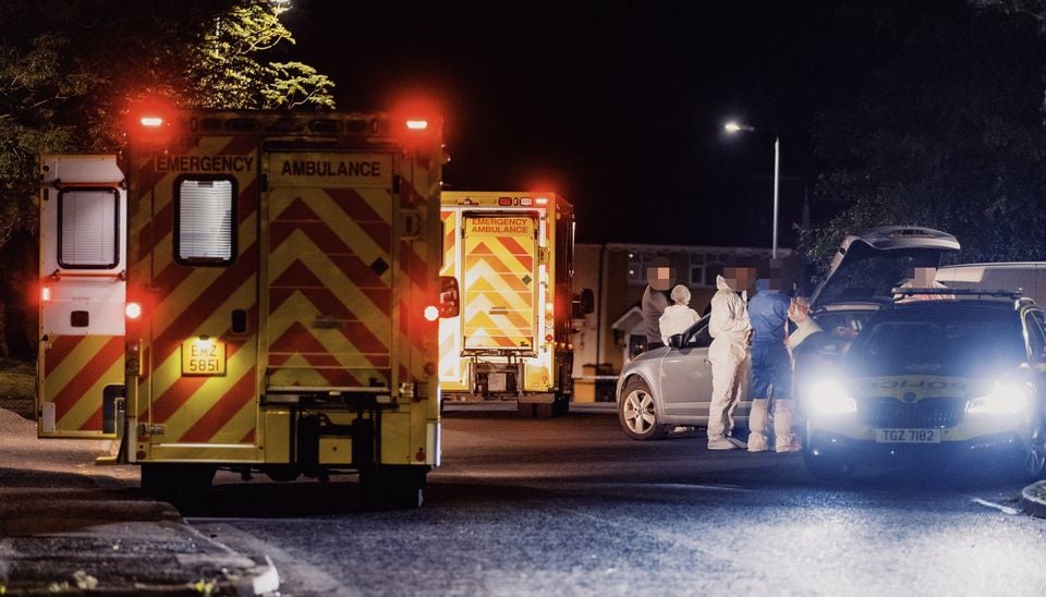 Police at the scene  in Twinbrook on Thursday night. Photo: Kevin Scott