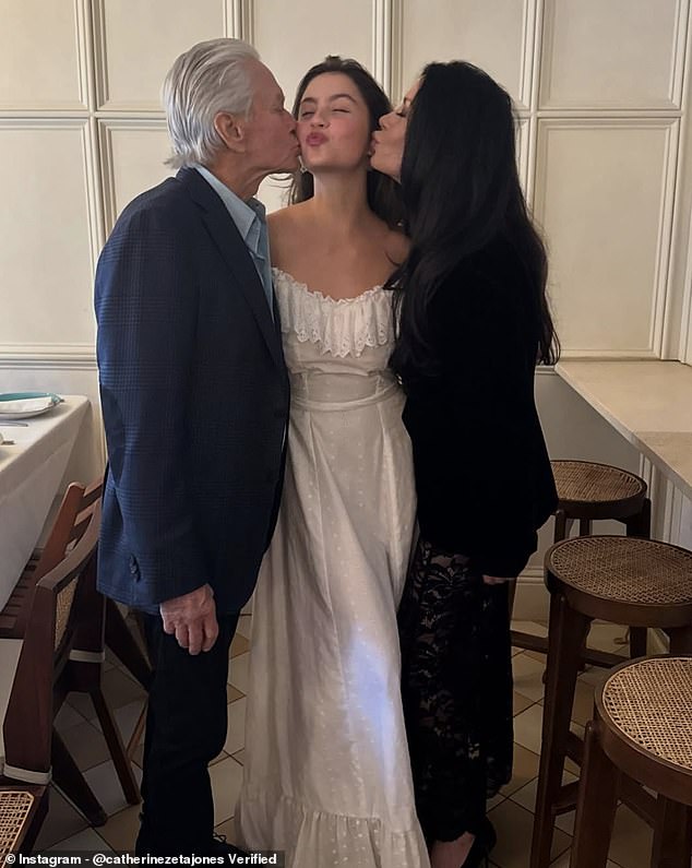 Zeta-Jones shared a snap of her and Michael Douglas kissing their daughter Carys on both cheeks as she marks the end of her studies at Brown University