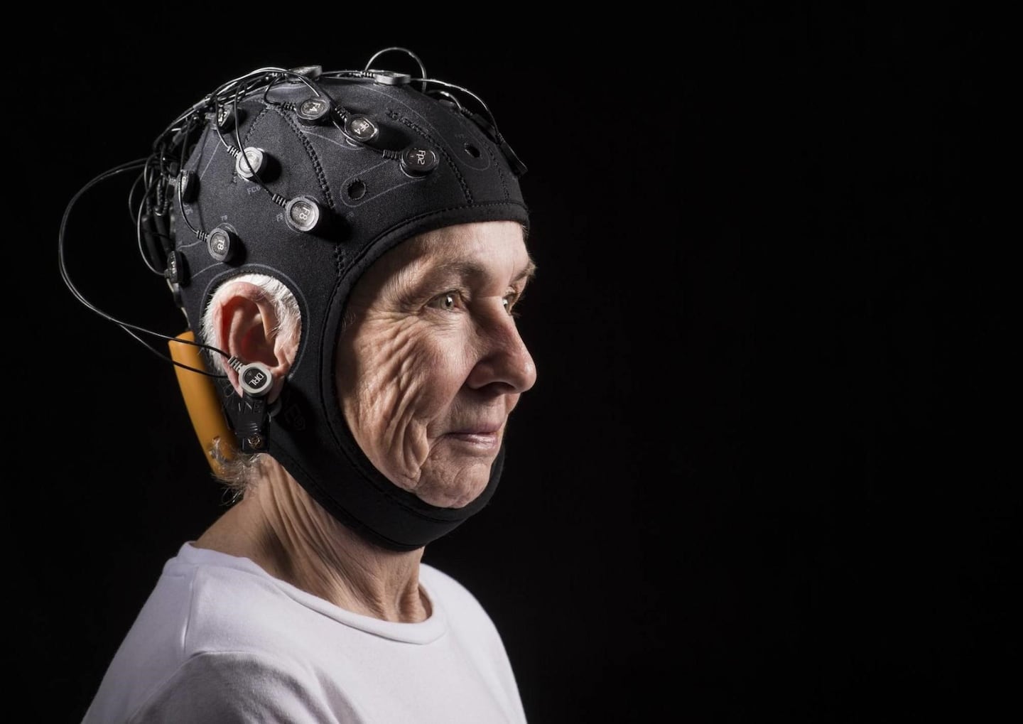 A woman models an example of the transcranial direct current stimulation cap used in the recent study by researchers at Hebrew SeniorLife. The cap used in the recent study had fewer electrodes on it.