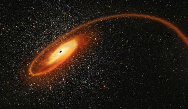 An illustration of a dark circle with a glowing disk around it surrounded by stars in space