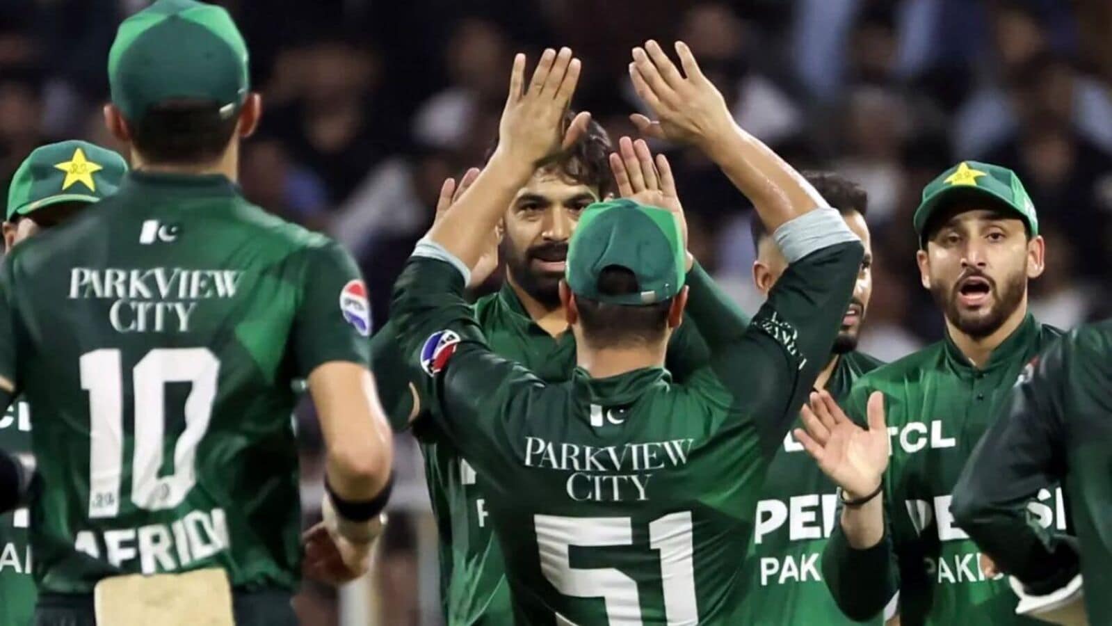 Pakistan players celebrate the fall of an Afghanistan wicket during their first match of the tri-series.