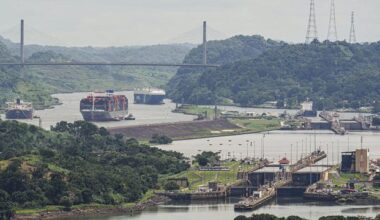 A cargo ship navigates through the Panama Canal, seen from the Cerro Ancon in Panama City