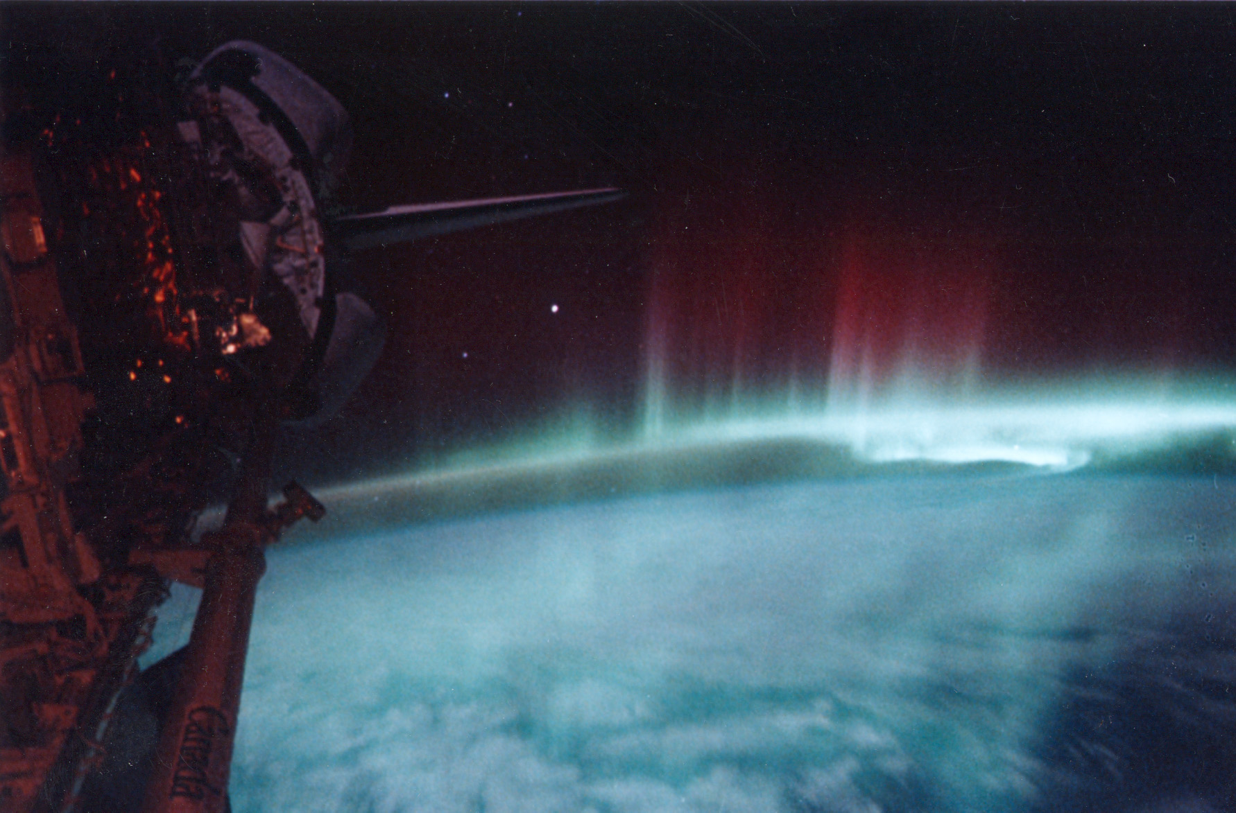 A red aurora is seen from space over Earth