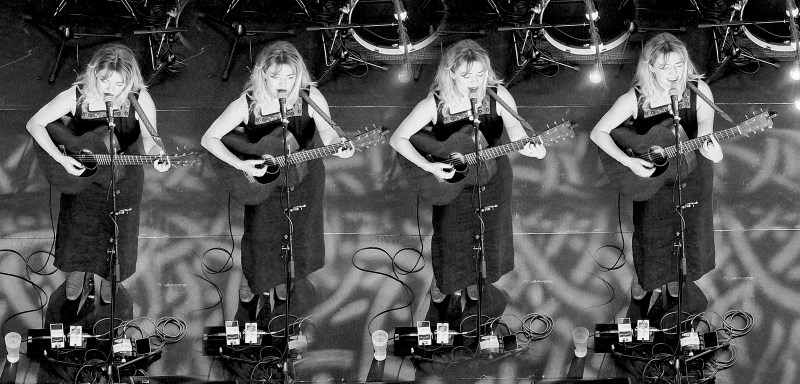 A photograph of Chloe Foy on stage at the Bristol Beacon