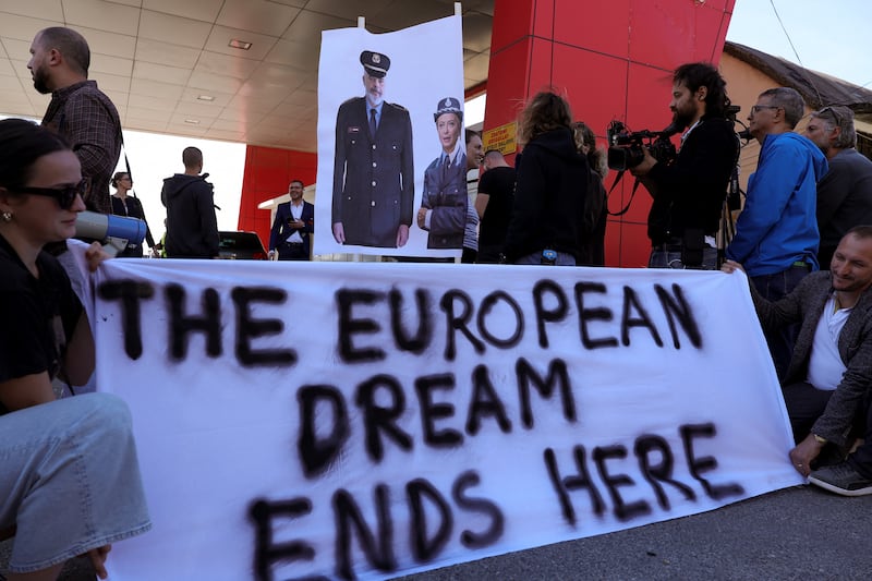 Civil rights activists protest after migrants intercepted in Italian waters arrive at Shengjin port in Albania in 2024. Photograph: Adnan Beci/AFP via Getty Images