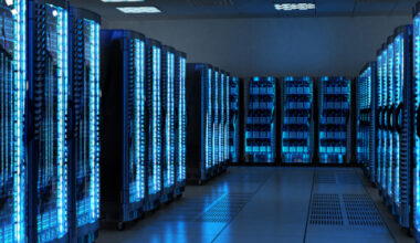 Server racks with telecommunication equipment in server room.
