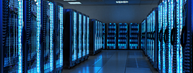 Server racks with telecommunication equipment in server room.