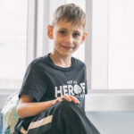 mason sits in the hospital before a visit for his dyskeratosis congenita